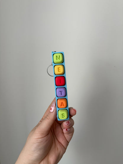 Personalizuotas fidget pakabukas - žaislas