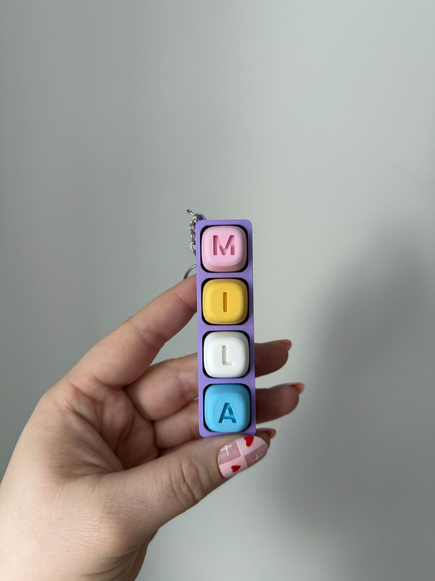 Personalizuotas fidget pakabukas - žaislas