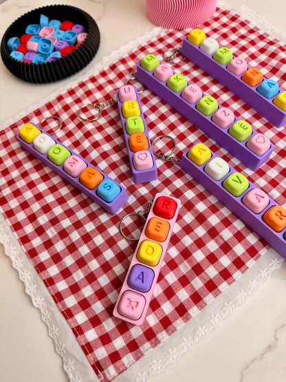 Personalizuotas fidget pakabukas - žaislas